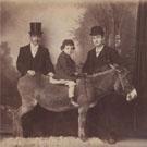 Unidentified sitters with donkey